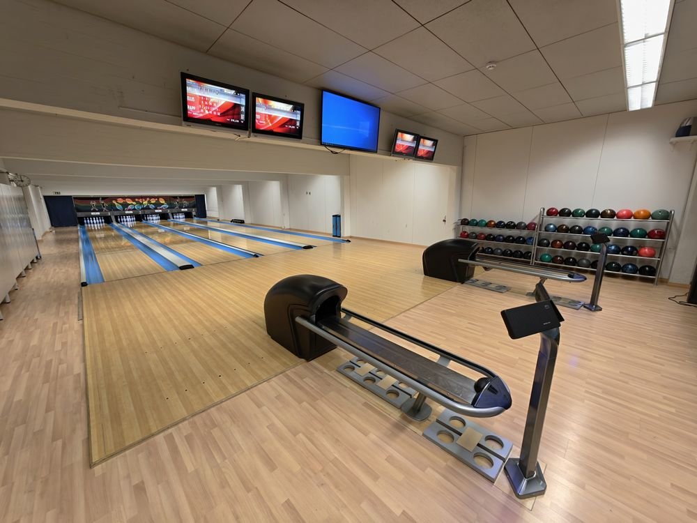 Modern bowling lanes with comfortable seating